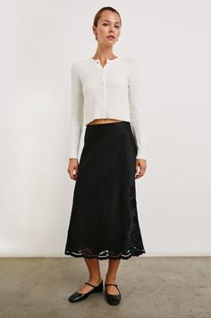 The midi skirt dreams are made of. This high-waisted pullover style is crafted from a luxe satin crepe fabrication with intricate eyelet detailing and features a concealed elastic waistband for all-day comfort. Dress down with a t-shirt or your favorite sweater, or add heels to transition from day to night.100% Acetate.Imported. Denim Sweater Jacket, Nye Outfits, Denim Sweater, Sneaker Dress Shoes, Denim Accessories, Black Wedding Dresses, Favorite Sweater, Dressed Down, Matilda