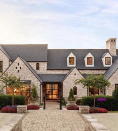 a large brick house with lots of windows