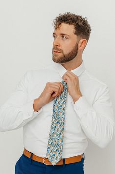 We pride ourselves in offering our customers some of the best skinny ties money can buy. Each DAZI tie is handmade from high quality imported fabrics. Features: Approx. 2.5" wide at the tip Approx. 58" in length 100% Cotton Don't forget a matching pocket square! Shop our ﻿Alpine Blum Pocket Square. Dapper Standard Tie, Dapper Fitted Standard Tie, Dapper Fitted Tie, Fitted Cotton Tie, Dapper Semi-formal Neckwear With Ties, White Neckwear With Ties For Work, Dapper Fitted Neckwear For Semi-formal Occasions, White Business Ties, Semi-formal Summer Standard Tie