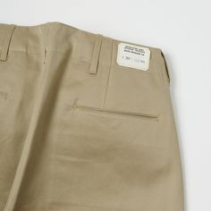 This brand new wide fitting chino from Buzz Rickson’s has been inspired by a 1942, US Army issue chino. The timeless vintage shape has been complimented by a high rise, and plenty of authentic detailing. Designed for comfort and ease of movement, the wide leg opening of this model makes this trouser very breathable and easy to wear. Known for their attention to detail, Buzz Rickson’s have custom manufactured a set of metal US Army sew in buttons for added authenticity. Two side entry pockets and Buzz Rickson, Pant Details, Formal Pants, French Army, Pants Details, Cotton Chinos, Sew In, Khaki Chinos, Us Army