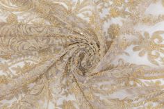 Champagne gold beads and embroidery on a champagne gold tulle. Elegant Intricate Embroidery Fabric For Evening, Elegant Festive Pearl Embroidered Fabric, Elegant Floral Embroidered Fabric For Party, Elegant Beige Embroidered Fabric For Festive Occasions, Elegant Pearl Embroidered Fabric For Reception, Elegant Embroidered Fabric With Pearl Embroidery For Reception, Elegant Embellished Embroidered Fabric For Formal Occasions, Gold Lace Tulle Fabric, Elegant Style, Elegant Floral Embroidered Fabric For Evening