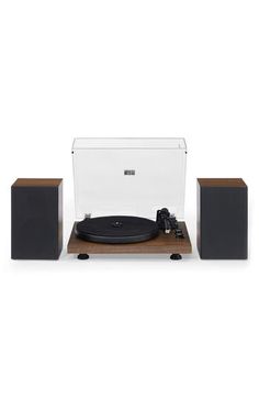 a record player and speakers on a white background