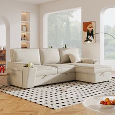 a living room with a white couch and black and white rugs on the floor