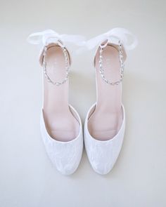 An all-time classic and elegant style with simplicity of lace heels adorned with rows of sparkly crystal embellishments across ankle tie. Comfort with simplicity and perfect for fall or summer wedding, bridesmaids, flower girls, bridal parties, birthday, holiday parties, or any of your special events.DETAILS:HEEL HEIGHT: 3 inchesCOLORS AVAILABLE: Ivory & WhiteUPPER: Synthetic upper and liningMATERIALS: Manmade outsole Elegant Embellished Wedding Shoes For Bridesmaid, Elegant Embellished Bridesmaid Wedding Shoes, Lace Wedding Shoes For Bridesmaids, Elegant Lace-up Bridesmaid Wedding Shoes, Elegant Lace-up Wedding Shoes For Bridesmaids, Lace-up Bridesmaid Wedding Shoes, Elegant Adjustable Wedding Heels, Elegant White Adjustable Heels, Elegant Adjustable White Wedding Shoes