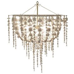 a white chandelier hanging from a ceiling