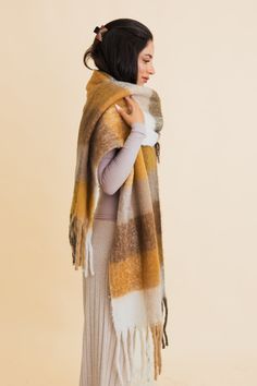 Wrap yourself in effortless coziness with the Cozy Breeze Oversized Fringe Scarf! A fall and winter must-have, this scarf features a timeless plaid pattern in soft, dreamy hues that bring both warmth and style to chilly days. Its oversized fit delivers all the snug feels, while the playful fringe adds just the right touch of flair. Whether you're sipping a pumpkin spice latte or strolling through a winter wonderland, this classic plaid scarf will keep you chic and cozy all season long! #lovemyle Dirty Hippie, Fall Winter Essentials, Winter Must Haves, Kimono Sweater, Cozy Scarf, Fall Scarves, Fringe Scarf, Cozy Fits, Bralette Tops