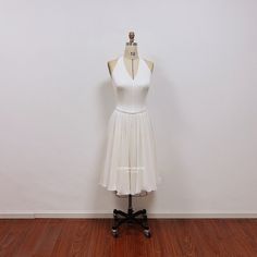 This 1960s cocktail dress is inspired by old hollywood style. This white halter dress is gorgeous for 1960s themed party or events. I use stretch fabric to make the top, and the skirt has 3 layers of chiffon fabric. This dress can be made to order in custom size. I have some stock for size US2, US4, US6, US8, US10. For custom size, please message me your bust/waist/hips measurements and your height. Below are the measurements of standard size 2 to size 10 in inches: Size 2(inches): Bust=32 Waist White Stretch Halter Dress For Party, White Stretch Halter Dress For Evening, White Halter Neck Cocktail Dress, White Stretch Elegant Halter Dress, White Stretch Halter Dress Elegant, Elegant White Stretch Halter Dress, Elegant White Halter Cocktail Dress, Chic White Halter Cocktail Dress, White Fitted Halter Dress For Formal Occasions