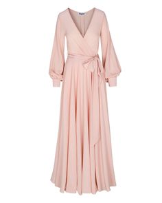 This 70's inspired maxi dress features a sexy cross front V-shaped surplice neckline. The elasticized waist adjusts to fit a range of sizes and has an attached self-tying belt at the right-hand side seam. The cuffed bell sleeves add a hint of retro glamour. The opaque fabric has a butter-soft hand with gorgeous, vibrant hues. The full, sweeping circle mid-length skirt is perfect for making a dramatic entrance to any event. The skirt is partially lined. ** Based on the settings of your display, c Circle Maxi Skirt, Dramatic Entrance, Retro Glamour, Fashion District, Surplice Neckline, Medium Dress, Mid Length Skirts, 70s Inspired, Women Clothes