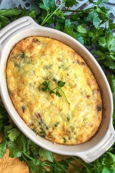 a casserole dish with parsley on the side, ready to be eaten