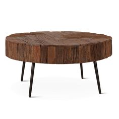 a round wooden table with black legs