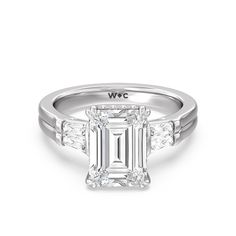 an emerald cut diamond engagement ring with three side stones