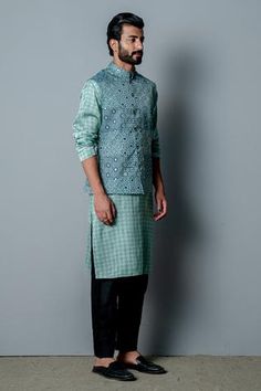 Aqua blue cotton silk printed bundi with embroidered detail. Paired with printed kurta pant. 
Components:3
Pattern:Embroidered, Printed
Type of Work:Cutdana work, Mirror work, Geometric print
Neckline:Mandarin
Sleeve Length:Full sleeves
Fabric:Cotton silk
Color:Blue
Other Details:
Cutdana and mirror work bundi
Occasion:Reception - Aza Fashions Cotton Nehru Jacket With Cutdana And Long Sleeves, Diwali Printed Chanderi Nehru Jacket, Diwali Nehru Jacket With Printed Motifs In Chanderi, Diwali Chanderi Nehru Jacket With Printed Motifs, Blue Chanderi Long Sleeve Bandhgala, Blue Long Sleeve Chanderi Bandhgala, Blue Chanderi Nehru Jacket For Designer Wear, Blue Cotton Bandhgala Straight Kurta, Cotton Nehru Jacket With Printed Motifs For Festivals