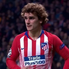 a young man in a red and white striped shirt