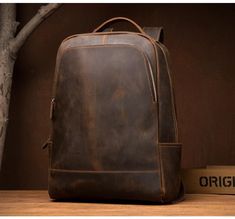 The Vernon Backpack is a simple, versatile, high-quality leather backpack. Essentials are carried in minimal style as this backpack features a roomy main compartment able to securely hold a 15” laptop, along with an exterior pocket included for items requiring quick and easy access. The backpack is designed to distribute weight evenly across the back, allowing heavy items to be carried comfortably, without compromising on style. The leather is high-quality crazy horse leather, which means that i Vintage Leather Travel Bag, Vintage Leather Messenger Bag, Backpack Essentials, Handmade Backpacks, Leather Laptop Backpack, Minimalist Backpack, Leather Rucksack, Leather Duffle Bag, Rucksack Backpack