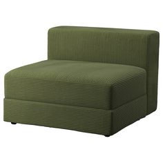 a green chair sitting on top of a white floor