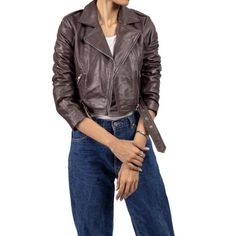 Elevate your wardrobe with our Chic Women's Cropped Leather Jacket. This stylish and versatile outerwear piece is designed for the modern woman who values both fashion and function. Crafted from premium, supple leather, this jacket offers a sleek silhouette that enhances any outfit, whether casual or sophisticated. The cropped cut provides a contemporary twist on the classic leather jacket, making it perfect for layering over dresses, blouses, or even a simple tee. Featuring a tailored fit, zipp Sleek Brown Leather Jacket For Fall, Sleek Leather Cropped Jacket With Long Sleeves, Classic Leather Cropped Jacket For Fall, Trendy Leather Jacket With Long Sleeves, Modern Brown Leather Jacket For Fall, Modern Fitted Biker Jacket For Fall, Brown Leather Long Sleeve Cropped Jacket, Brown Leather Cropped Jacket With Long Sleeves, Classic Leather Cropped Jacket