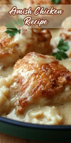 a close up of chicken in gravy on a plate