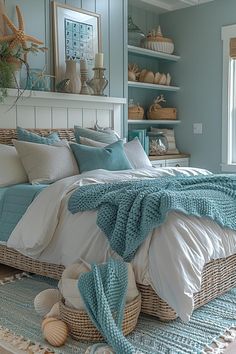 a bedroom with blue walls and white bedding