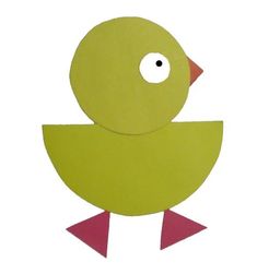 a paper cut out of a green bird with pink feet and beak, sitting on a white surface