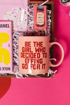 On a bright pink and red background, an assortment of Lizzo items are arranged among white packing crinkle and  mini disco balls. The photo is a close-up of a mug that says "Be the Girl who Decided to Effing Go For It" in red collegiate font, an Up and Up Salted Caramel Milk Chocolate bar, gum that says "Bitch I am the Secret Ingredient" and a set of Patchology 'Happy Place' eye masks. Color Coded Gift Boxes, Color Gift Boxes For Best Friend, Gift Pictures, Gift With Purchase, Luxury Gift Boxes, Pink Color Box Gift, Curated Christmas Gift Boxes, Small Gift Ideas, Custom Gifts