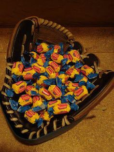 a basket filled with candy sitting on top of a floor