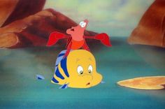 the little mermaid is riding on top of an orange fish in the water with another yellow fish