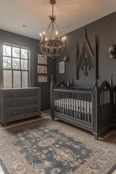 a baby's room with a chandelier, crib and dressers