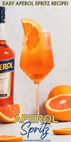 an ad for aperol spirits with oranges and a bottle