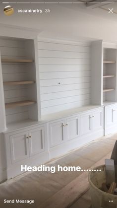 an empty room with built in cabinets and shelves