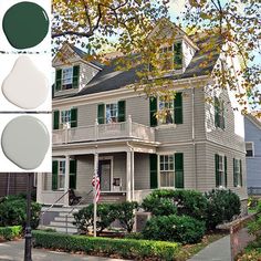 a house with green shutters and white trim on the front, two story houses in different colors