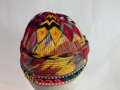 "Very colorful interesting hat from Uzbekistan, probably at least 25 years old. This would fit a small head or a boy. Measures 19.5\" inside hat. It is embroidered on top of quilted Uzbek traditional colorful fabric. Around the base is embroidery, typical of that found in other Uzbek clothing. This has been worn, but is in good condition for further wear. S&H included." Vintage Multicolor Flat Cap, Traditional Multicolor Hat With Curved Brim, Traditional Embroidered Baseball Cap, Multicolor Embroidered Cap, Embroidered Multicolor Cap, Traditional Adjustable Hat With Multicolor Embroidery, Vintage Beanie Hats For Festivals, Traditional Multicolor Embroidered Hat, Traditional Embroidered Multicolor Hats