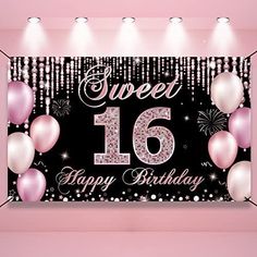 a happy 16th birthday banner with balloons and streamers on the wall in a pink room