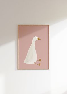 a white duck is sitting in front of a pink wall with a light shadow on it