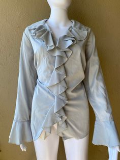 Grey blouse with ruffle detail and button up front.  --- Condition: Great vintage condition  --- Size: 14W - fits like a Large  Measurements:  --- Material: polyester Solvang Ca, Womens Blouses, Grey Blouse, Ruffle Shirt, Womens Clothing Tops, Blouses For Women, Ruffle Blouse, Button Up, Blouses