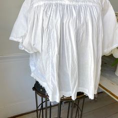 Hello and welcome to the Textile Trunk! Please follow us on Instagram , our user name is textiletrunk A fabulous rare find! Lace trimmed, GORGEOUS! his textile is a choir blouse dating from c 1900 or late 1800's. Made of crispy white cotton , This shirt was a Choir blouse and has lovely mends! ~ it was used and loved. The bottom of this chior shirt is cut, with no hem so probably had a lace addition that was removed ( condition reflected in the price ) ( Eshirt 85) MEASUREMENTS : This textile me Cottagecore Short Sleeve Tops For Daywear, Cotton Broderie Anglaise Blouse For Daywear, White Cotton Yoke Top, Cotton Blouse With Broderie Anglaise For Daywear, Classic Lace Tops For Daywear, White Cotton Blouse For Gatherings, Broderie Anglaise Cotton Lace Tops For Daywear, Cotton Peasant Blouse For Daywear, Summer Daywear Shirt With Lace Trim