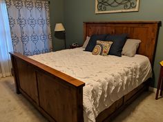 a bedroom with a large bed and blue walls