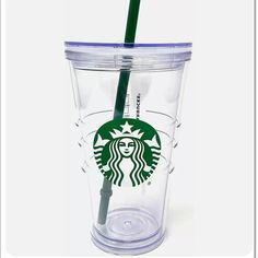 a starbucks cup with a straw sticking out of it's side and the lid