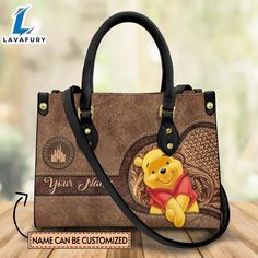 Custom Name Winnie the Pooh Theme Premium Leather Handbag It’s a practical accessory for fashion-conscious individuals on the go and makes an excellent gift choice for special occasions. The bag is crafted with care and attention to detail, made of high-quality PU leather with a soft microfiber layer that protects your belongings. It features two zippered pockets, one flat pocket, and one detachable pocket, making it ideal for organizing your essentials. The bag is spacious enough to hold everyd Leather Bag Tag, Winnie The Pooh Cartoon, Custom Leather Bag, Small Hand Bags, Winnie The Pooh Themes, Vegan Leather Boots, Disney Handbags, Leather Bag Women, Stitching Leather