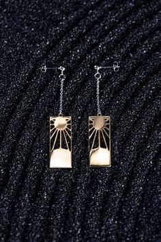 Hanafuda earrings have traditionally been passed down through generations, and the significance of these earrings runs even deeper. Rumored to be a secret mark of the Breath of the Sun style, we hope you embody the strength and courage that these earrings represent. Materials: 18K Gold Plated Brass, Stainless Steel Earring dimensions: Approx. 2.5" by 0.5" (including chain length). Each earring weighs approximately 3 grams (the weight of one penny) Symbolic Etched Jewelry For Promise, Tarnish Resistant Dangle Linear Earrings Gift, Nickel-free Spiritual Jewelry For Promise, Rectangular Linear Earrings For Gift, Brass Long Drop Jewelry For Gifts, Silver Brass Jewelry For Promise, Symbolic Nickel-free Drop Plug Earrings, Nickel-free Symbolic Drop Plug Earrings, Symbolic Metal Jewelry With Matching Earrings