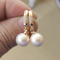 Welcome to my shop my dear friend. I hope you will like my jewelry, and most of my jewelry are made by myself. Please see the detail for this item: Pearl Jewelry: earrings material: shell pearl, Gold plated luster: good Size: 12mm in the pictures Pearl Color: as the pictures other color size, could contact me please. About shipping: I will send out your order in 3-5 business days from China. Generally takes 10-20 days to reach. Sometimes maybe a little earlier or later Please note that the Unite Pearl White Round Earrings For Everyday, Gift Pearl Earrings With Round Beads, Hypoallergenic Beaded Earrings For Anniversary, Pearl Earrings With Round Beads As Gift, Pearl Earrings With Round Beads For Gift, Pearl Jewelry Earrings, Pearl Powder, Earrings Everyday, My Dear Friend