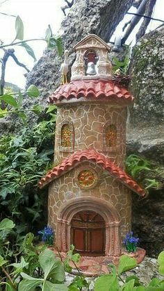 a small house made out of stone and clay