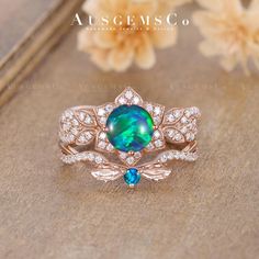 a ring with an opal surrounded by diamonds