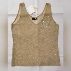 This Vintage (Early 2000s) Never Out-Of-Style Votre Nom Tank Top With A Deep V-Neck, And Tonal Sequin Embellishment, Is Sure To Be Eye-Catching. It Comes In A Beautiful Neutral Beige/Champagne Tone With Sequins In The Front And Sheer Mesh In The Back. Style It With A Maxi Skirt And A Cropped Jacket For A Sparkling Daytime Look Or With Jeans For A Dazzling Nighttime Party Look. New Without Tag; "Never Worn." The Votre Nom Brand Label Is Attached With Extra Replacement Sequins. Votre Nom Is A Fren Beige Champagne, Sheer Mesh Top, Sequin Embellishment, Party Look, Brand Label, French Brands, Neutral Beige, Sequin Fabric, Cropped Jacket