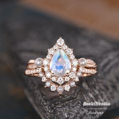 "Pearl Moonstone Engagement Ring Set Rose Gold Pear Shaped Moonstone Ring Cluster Halo Diamond Women Bridal Set Ring Infinity Wedding Set Similar style: https://www.etsy.com/listing/1173648368 ITEM INFORMATION Metal Type - Solid 14k Rose Gold Band Width - (approx. 2.2mm) Engagement ring: Center Stone - 6x8mm Natural Morganite, Pear Shaped Side Stone - Natural Akoya Pearl Size- 2.5mm Side Stone - Natural Diamond, H color, SI clarity/Moissanite, D color, VVS clarity Weight - 0.68ct Side Colorless Moonstone Engagement Ring Set, Infinity Wedding, Ring Cluster, Cute Engagement Rings, Future Engagement Rings, Pear Ring, Moonstone Engagement, Moonstone Engagement Ring, Bridal Ring Sets