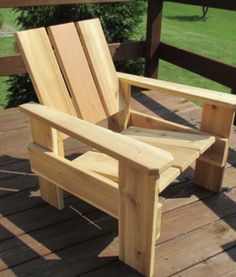 a wooden chair sitting on top of a wooden deck