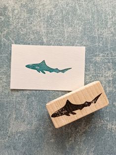 a rubber stamp with a shark on it