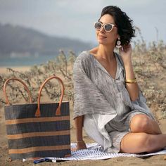 Looking for a unique and gorgeous beach tote? This raffia bag is made from high-quality raffia palm with a natural and grey alternating stripe. These bags have a useful cotton pull closure, inside pocket, and beautiful zebu leather handles, and are big enough to handle even the longest beach days! All our raffia totes are made by a fair-trade woman-owned company in Madagascar. 17.5" x 13.5" x 8" 7" handle drop. Handwoven Natural Bags For Summer Outings, Striped Woven Rectangular Beach Bag, Handwoven Straw Bag For Beach Season, Natural Handwoven Straw Bag For Summer Outings, Beach Bag With Bamboo Handle For Vacation, Handwoven Striped Beach Bags, Natural Beach Bag For Summer Vacation Outings, Natural Beach Bag For Summer Outings And Vacation, Handwoven Striped Bags For Vacation