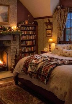 a bedroom with a bed, fireplace and bookshelf in the corner is decorated for christmas