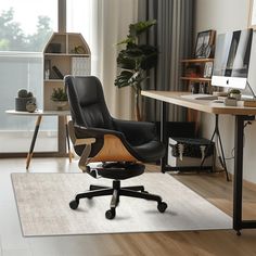 an office with a desk, chair and computer on the floor in front of a window