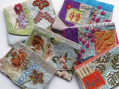 several pieces of colorful fabric with flowers and butterflies on them